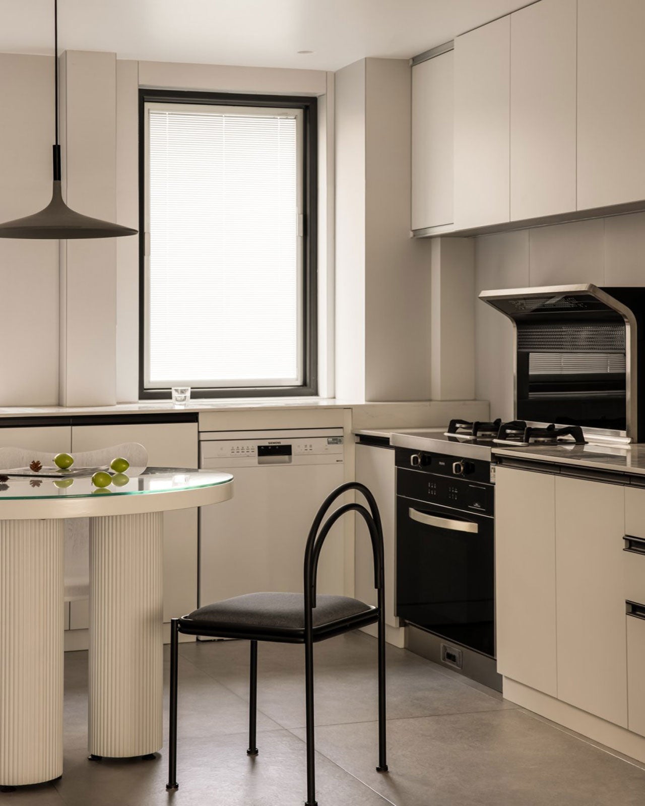 Discover the Beauty of Minimalism with a Round Glass Dining Table