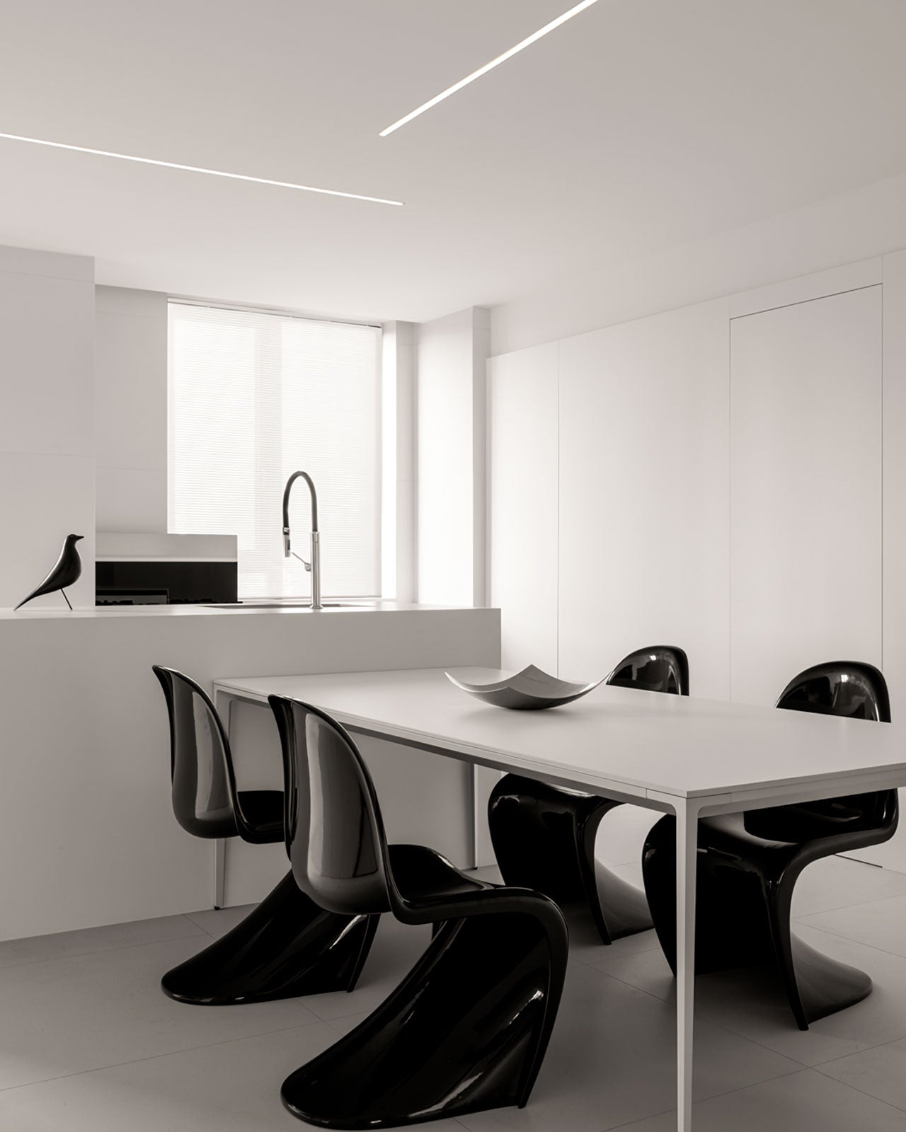 Minimalist Home Design: The Artistry of Black Curved Chairs