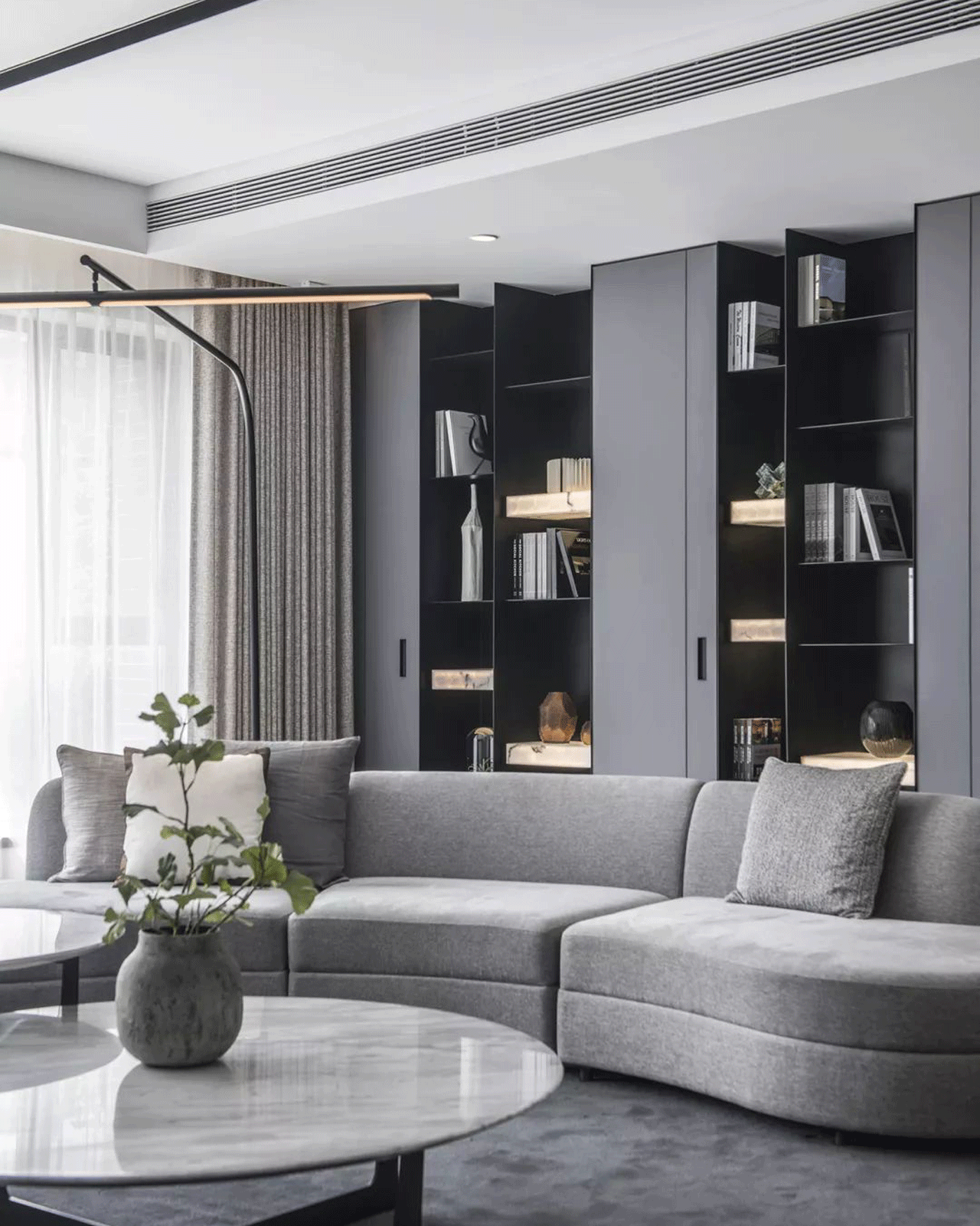 A Touch of Modernity: Grey Curved Fabric Sofa